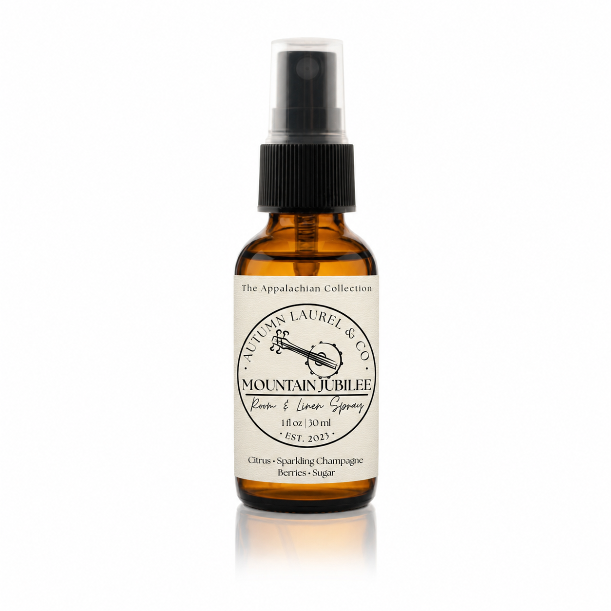 Mountain Jubilee room and linen spray in a 1 ounce amber glass bottle with cream linen label