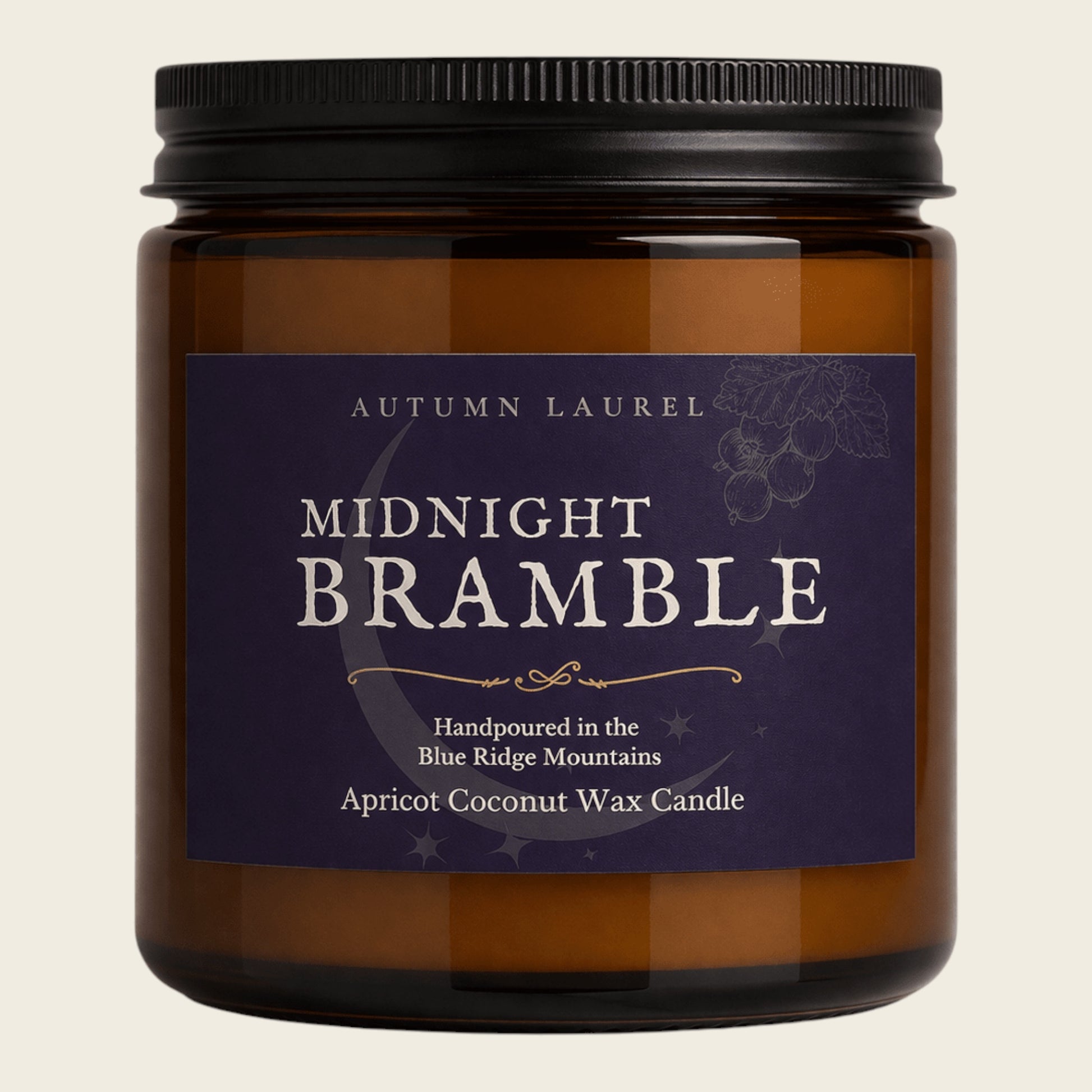 An amber glass jar candle with a black ribbed lid and a dark purple label reading 'Autumn Laurel Midnight Bramble Apricot Coconut Wax Candle' on a light beige background.