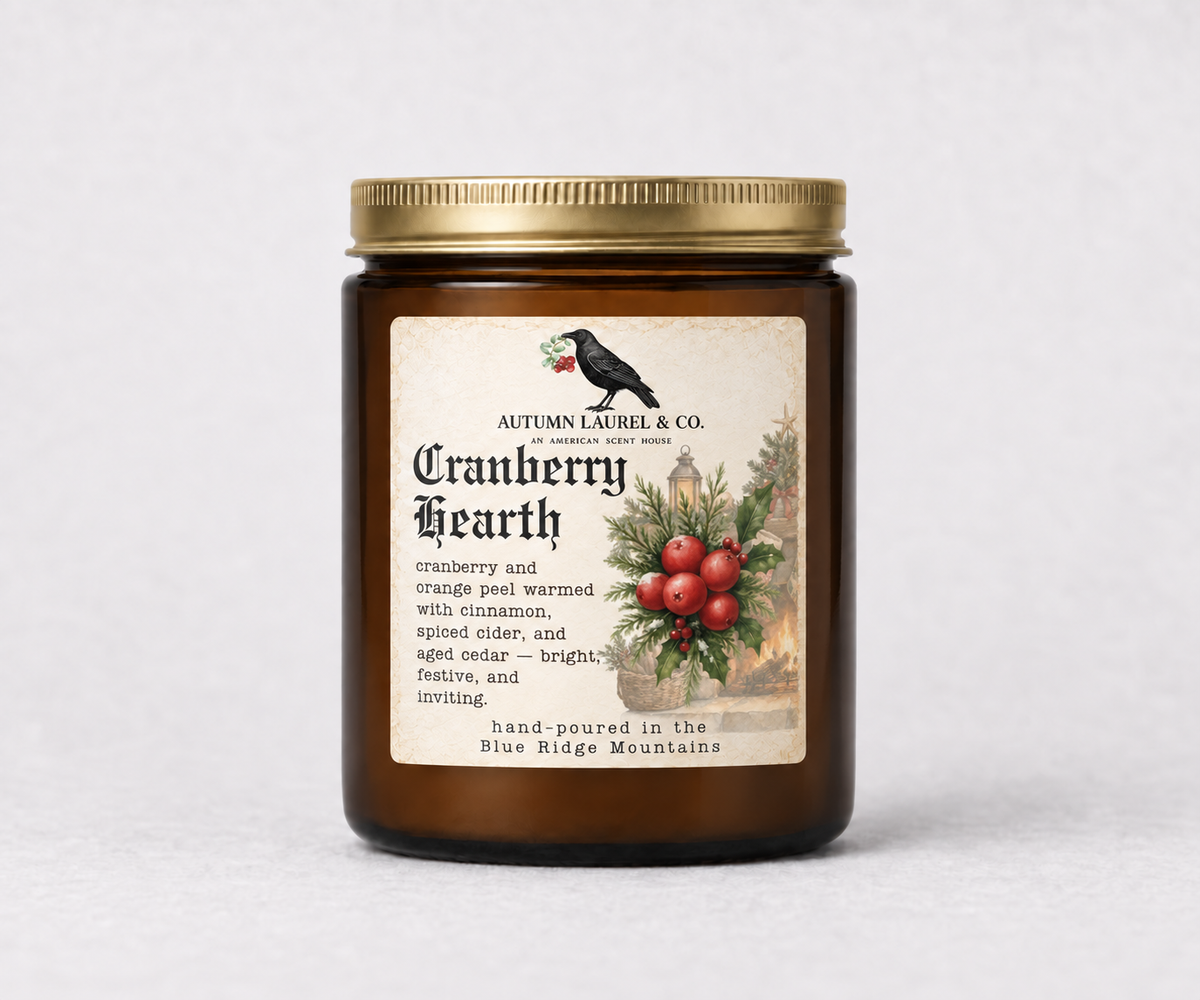 Cranberry Hearth amber jar candle with updated Old English Christmas label