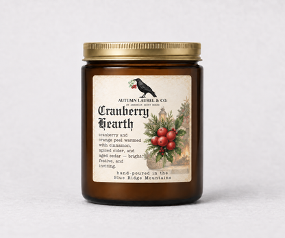 Cranberry Hearth amber jar candle with updated Old English Christmas label