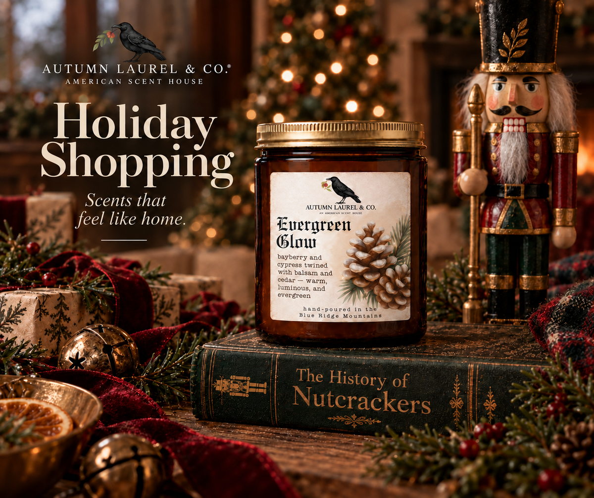 Evergreen Glow candle beside a Christmas nutcracker, resting on a vintage book amid festive greenery.