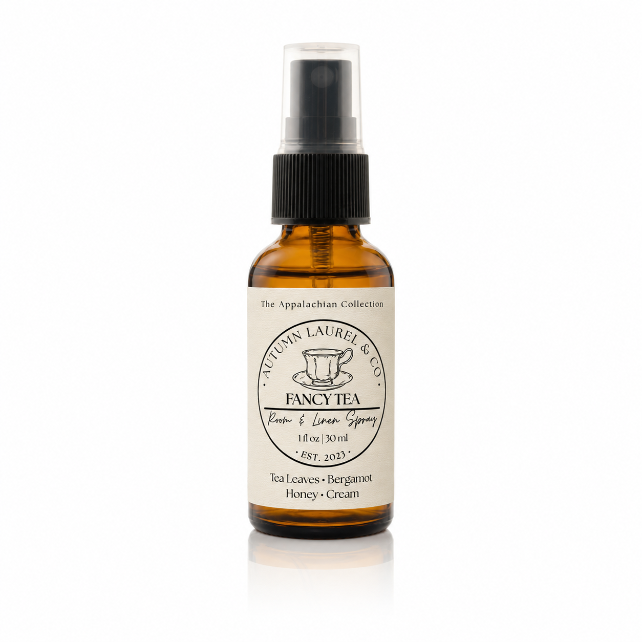 Fancy Tea room and linen spray in a 1 ounce amber glass bottle with cream linen label