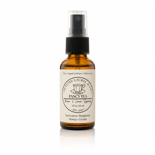 Fancy Tea room and linen spray in a 1 ounce amber glass bottle with cream linen label