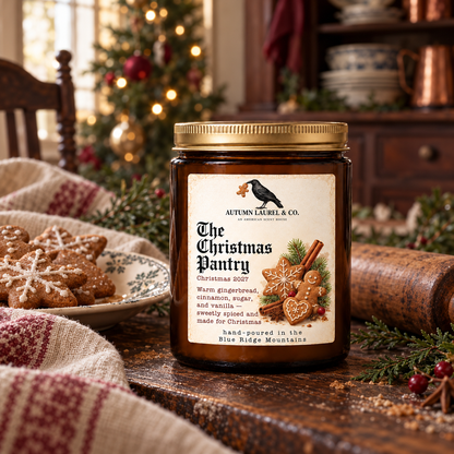 The Christmas Pantry candle styled with gingerbread and vintage Christmas decor