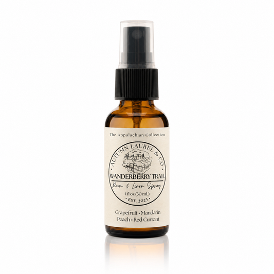 Wanderberry Trail room and linen spray in a 1 ounce amber glass bottle with cream linen label