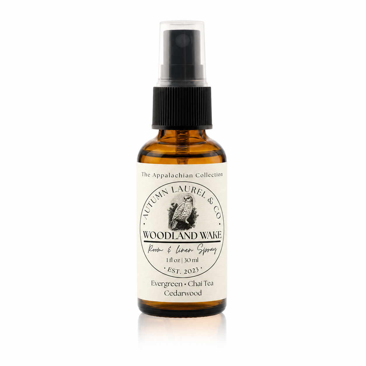 Woodland Wake room and linen spray in a 1 ounce amber glass bottle with cream linen label